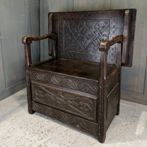 16th Century Style Carved Oak Monks Bench by Newbery & Spindler (SOLD)