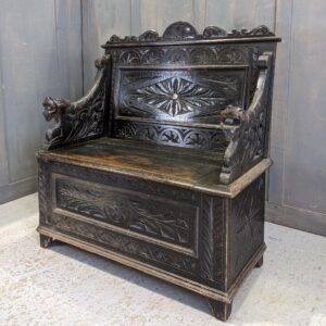 Highly Carved Antique Dark Oak Monks Bench with Dragon Armrests (SOLD)