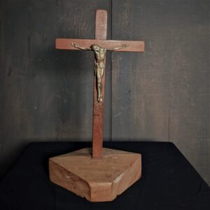 Ascetic Bronze Mid Century Crucifix atop a Rock like Slab of Teak (SOLD)