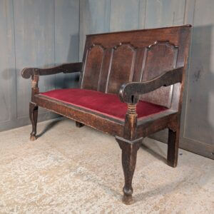 A Small George III Panelled Oak Settle with Upholstered Seat
